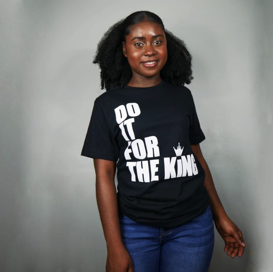 a female with Do it for the king shirt